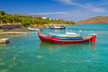 Fototapeta na wymiar Fishing boats on the blue lagoon of Crete, Greece
