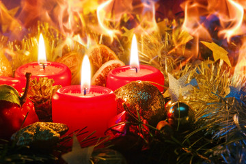 Three Advent candles and christmas decoration .