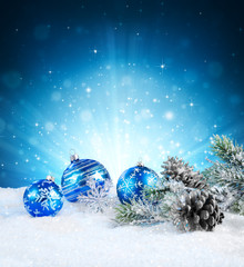 magic of christmas - blue balls on snow.