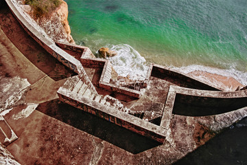Turquoise water and concrete stairs