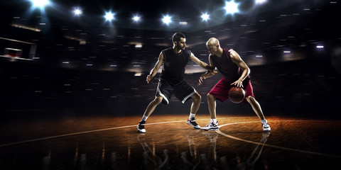 Two basketball players in action