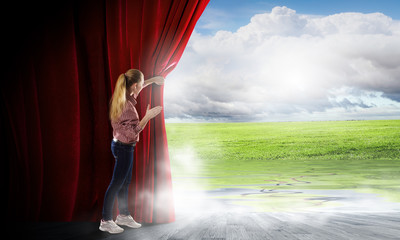 Girl opening curtain