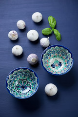 Chinese solo garlic and ceramic bowls, high angle view