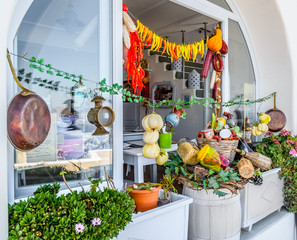 Traditional Greek food on the shop bench in Santorini