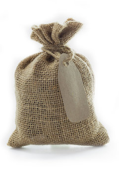 Empty textile burlap sack with blank tag