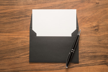 Blank paper, envelope and pen