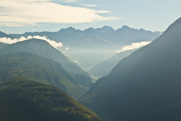 View of misty alpine valley