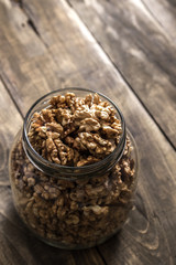 Glass jar with band full of cracked walnuts