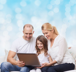 smiling family with laptop