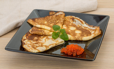 Pancakes with red caviar