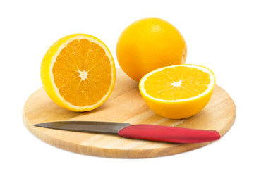 orange on a cutting board and knife