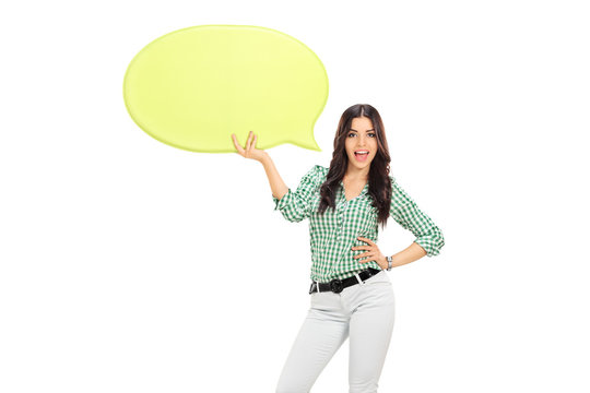 Young girl holding a yellow speech bubble