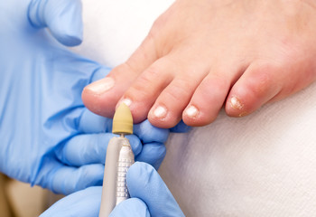 process of pedicure at beauty salon fingers hands