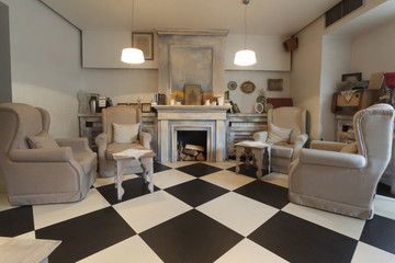 armchairs and fireplace in restaurant interior