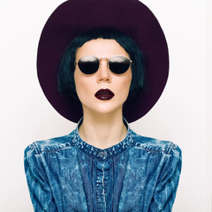 fashion portrait glamorous lady in a vintage hat and glasses