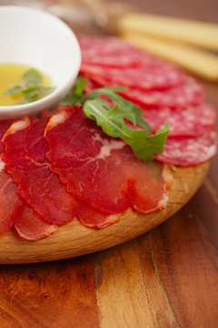 wooden board of Assorted Cured Meats