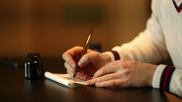 Man writining some text by pen
