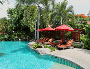 swimming pool with sun loungers