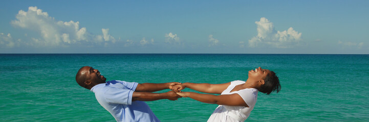 Happy young couple on blue ocean background.