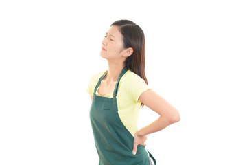腰痛を訴える女性