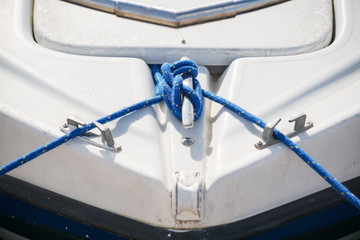 blue rope on a white boat - Powered by Adobe