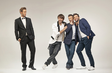 Laughing guys in elegant clothes