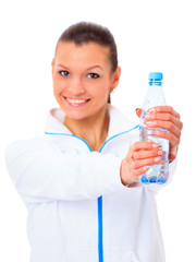 Beautiful fit mixed race female model holding a bottle of water