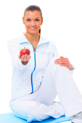 Fitness woman happy smiling holding apple