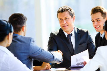 Business colleagues sitting at a table during a meeting