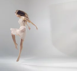 Wandaufkleber Talented young jumping ballet dancer © konradbak