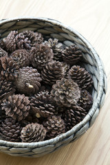 The cones ornament in woven bowl