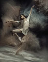 Gordijnen Dancing ballet dancer with dust in the background © konradbak