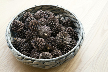 The cones ornament in woven bowl