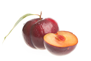 Red plums isolated on white background