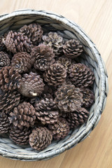 The cones ornament in woven bowl