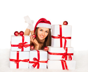 girl with Christmas gifts lying on the carpet