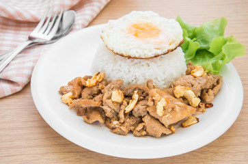 Fried pork garlic and pepper with fried egg on rice, Thai food s