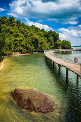 Fototapeta premium Tropical Coastline Boardwalk. Pulau Ubin, Singapore. Vertical Natural Beauty Background.