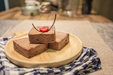 Homemade chocolate tart on a wooden board