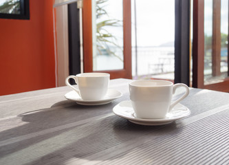 Coffee cup on table morning in restaurant cafe
