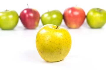 yellow apple on the background of colored lines apples