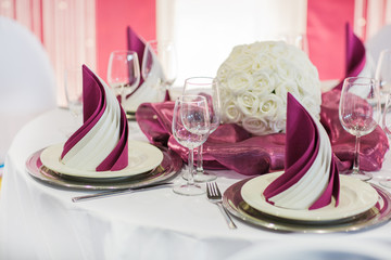 Elegant table set in soft creme for wedding or event party.
