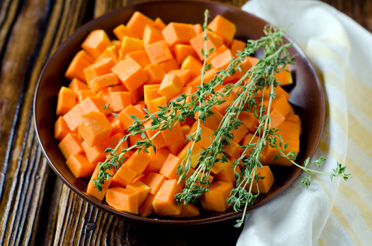 Slices of roasted pumpkin with thyme