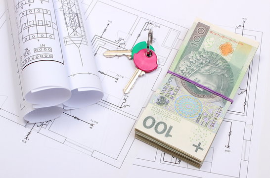 Banknotes, keys and electrical diagrams on drawing of house
