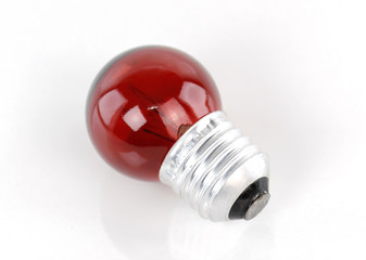 Red light bulb isolated on white background
