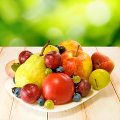 Naklejka na ściany i meble ripe fruits on a plate