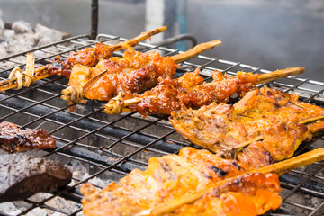 grilled chicken on flame, thai food