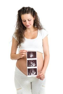 pregnant woman is holding her Ultrasound