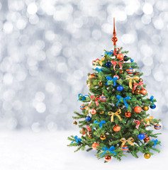 Festive Christmas tree in winter snow