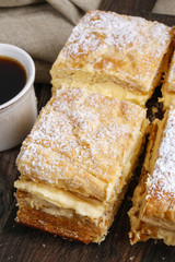 Cream pie made of two layers of puff pastry, filled with whipped